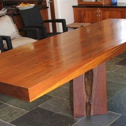 Live edge timber dining table on a slate floor, Portlock Residence, Oahu