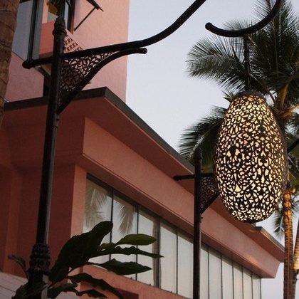Pierced pendant lanterns among palms, Royal Hawaiian Hotel, Waikiki