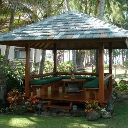 Thatched pavilion with a built in bench beside the lawn, Waimanalo Beach House, Oahu