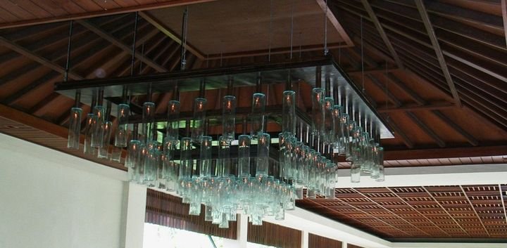 Suspended glass chandelier under a timber ceiling, Vimala Resort, Bali